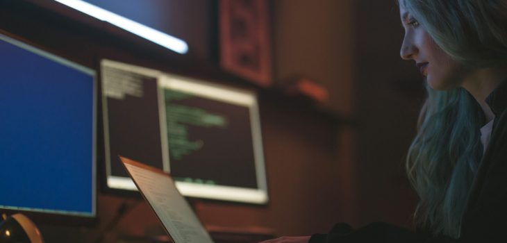 Free Side View of a Woman Using a Laptop Stock Photo