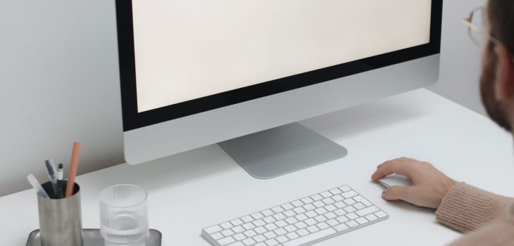 Free Crop man working on computer in workplace Stock Photo