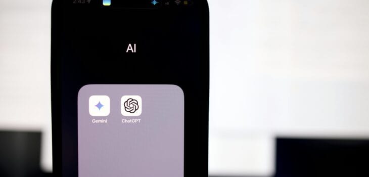 a close up of a cell phone with an ai button