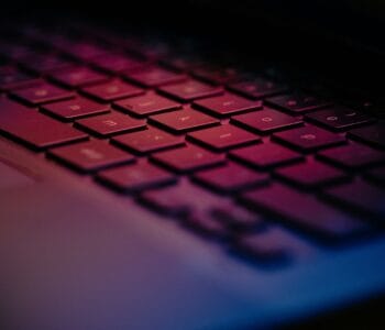 a-close-up-of-a-keyboard-with-a-blurry-background