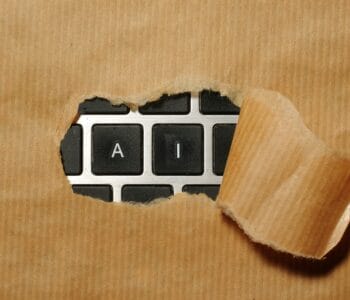 A piece of cardboard with a keyboard appearing through it