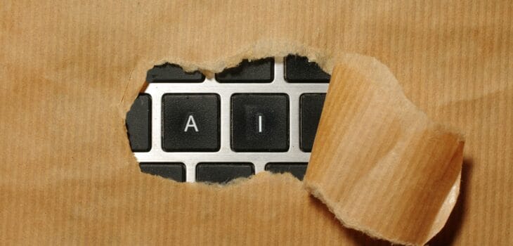 A piece of cardboard with a keyboard appearing through it