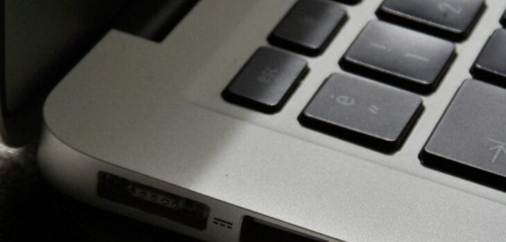 Free Detailed view of a silver laptop showing keyboard and multiple ports. Stock Photo